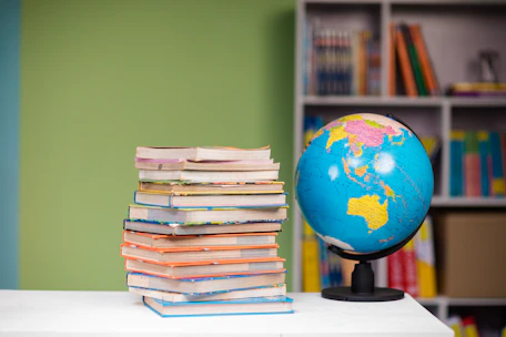 A happy student holding books with a globe and airplane in the background.