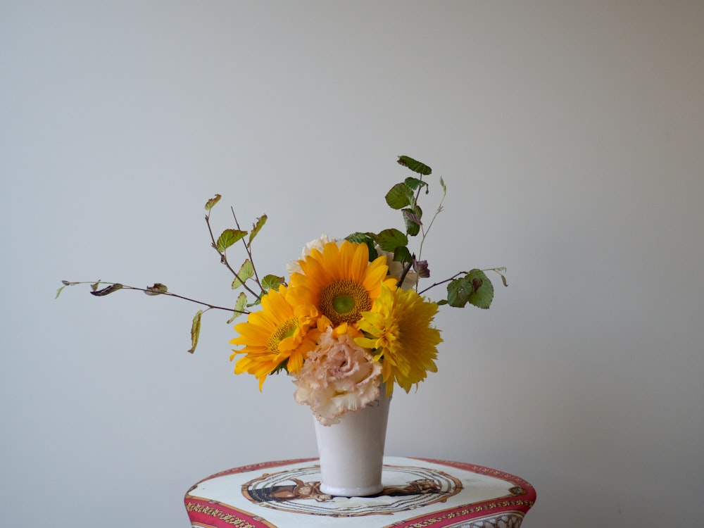 a vase with yellow flowers