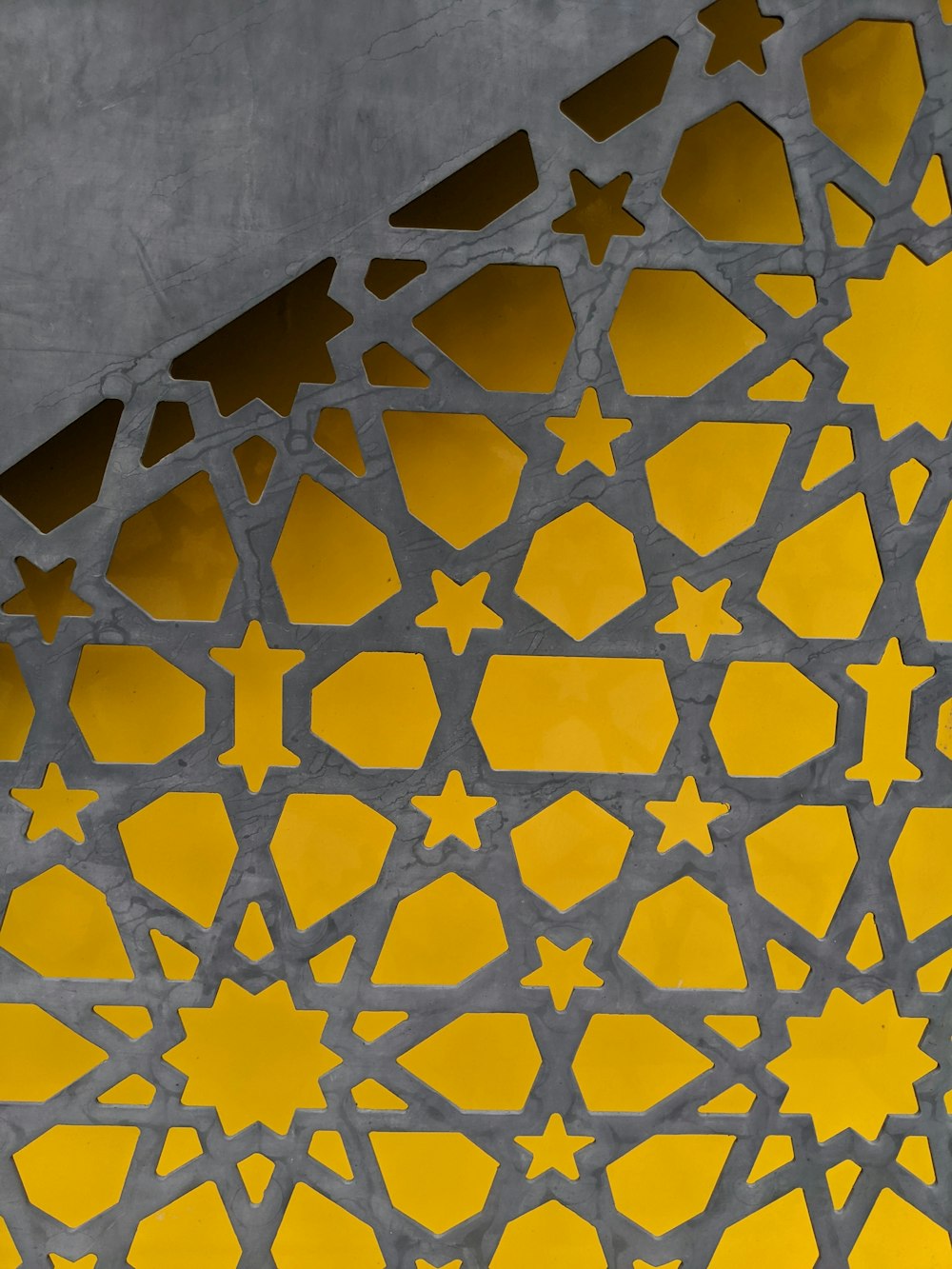 a yellow and white patterned surface