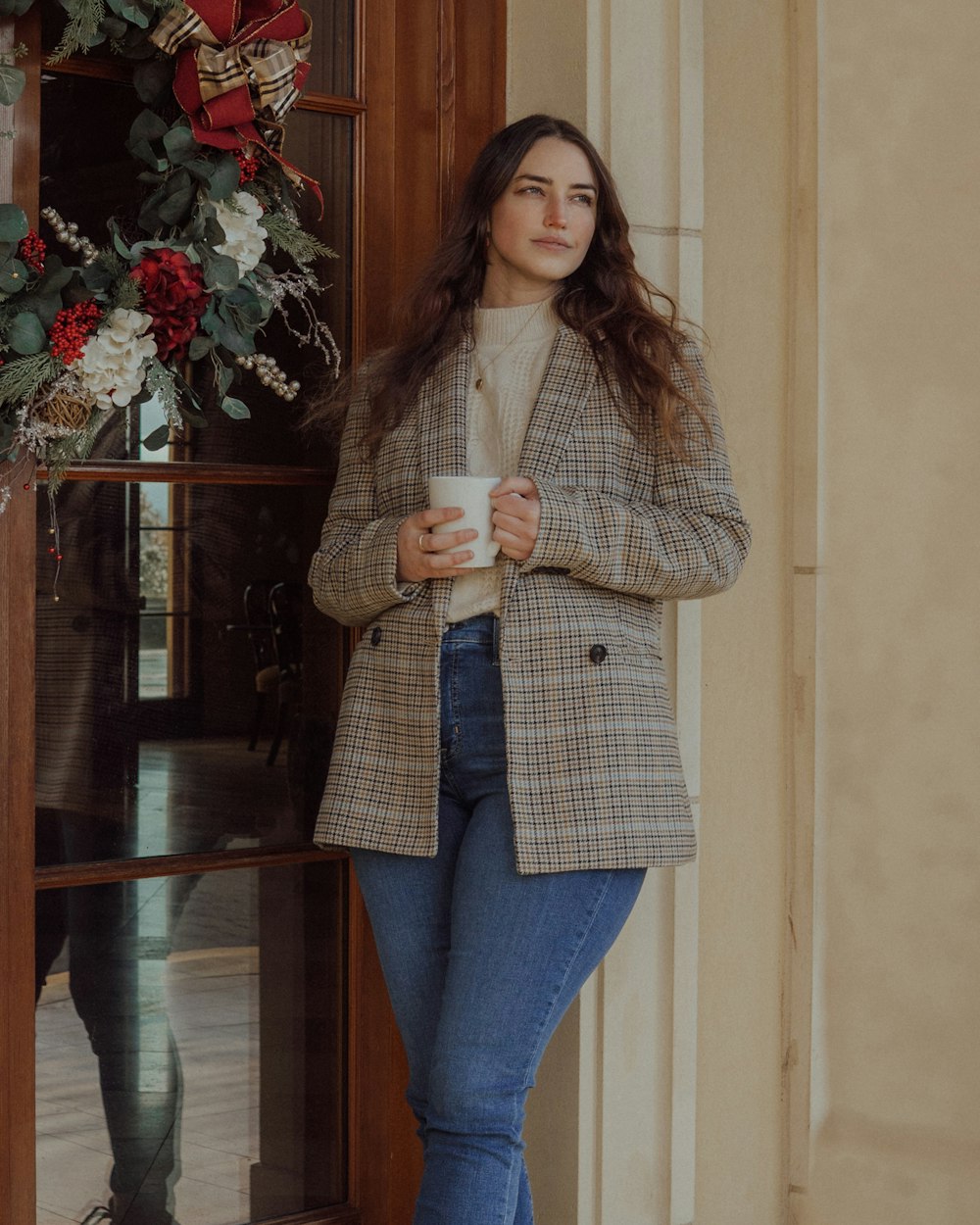 a woman holding a cup