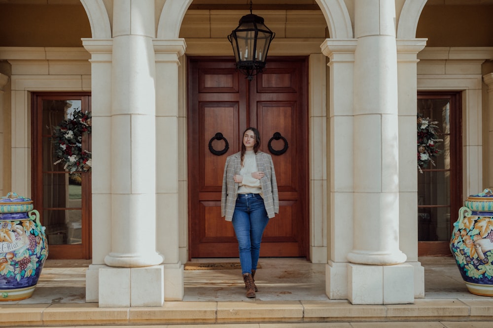 a person posing in front of a door