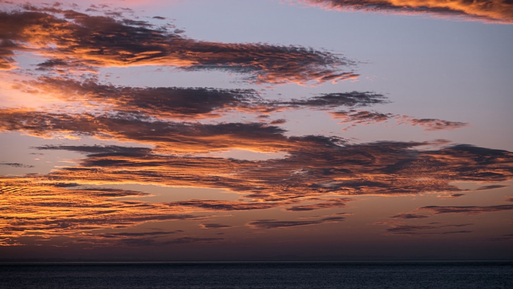 a sunset over the water