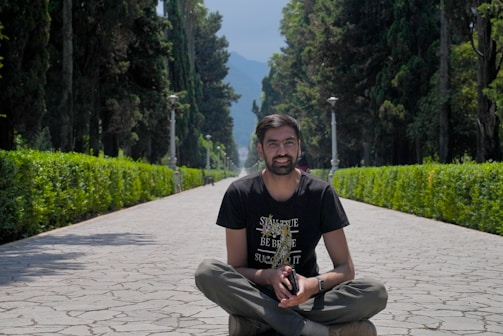 A confident man practicing mindfulness outdoors.