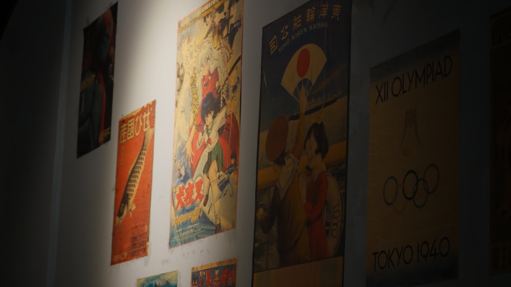 a group of posters on a wall