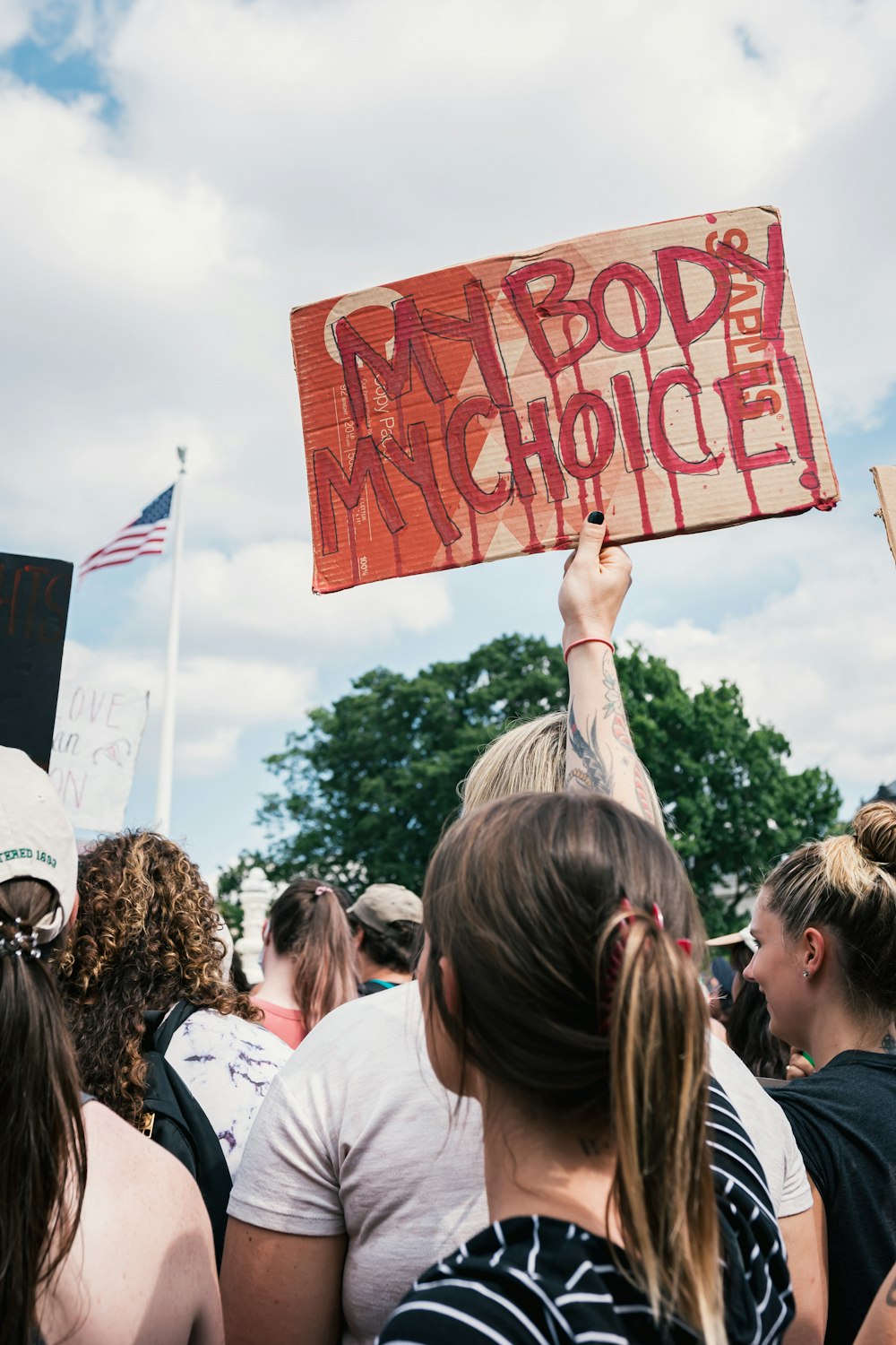 a group of people holding signs