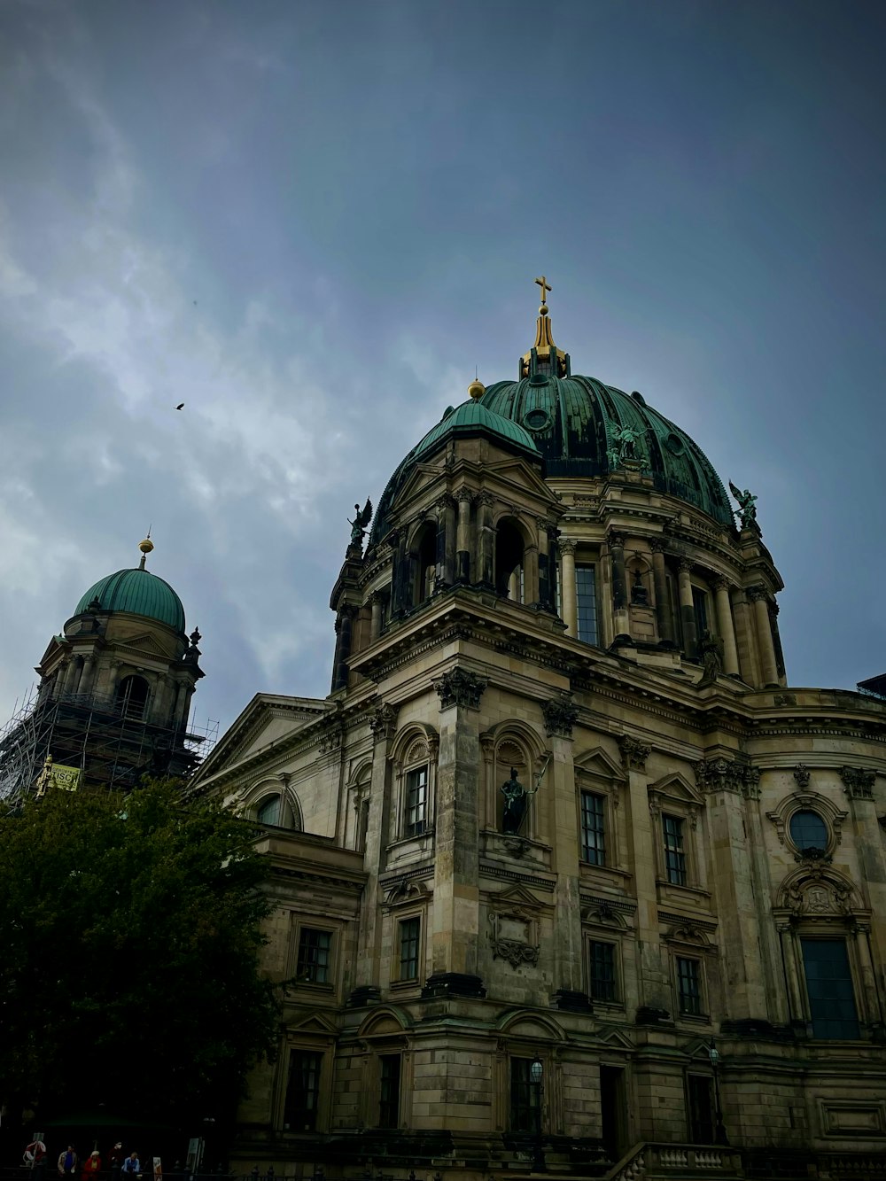 a large building with a green dome