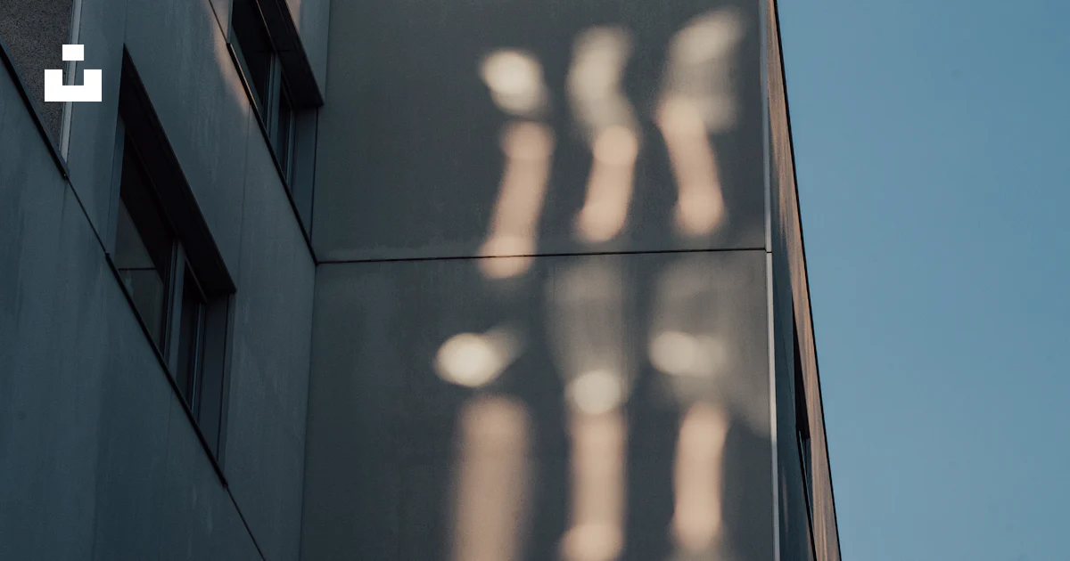 A building with a shadow on the side photo – Free Building Image on ...