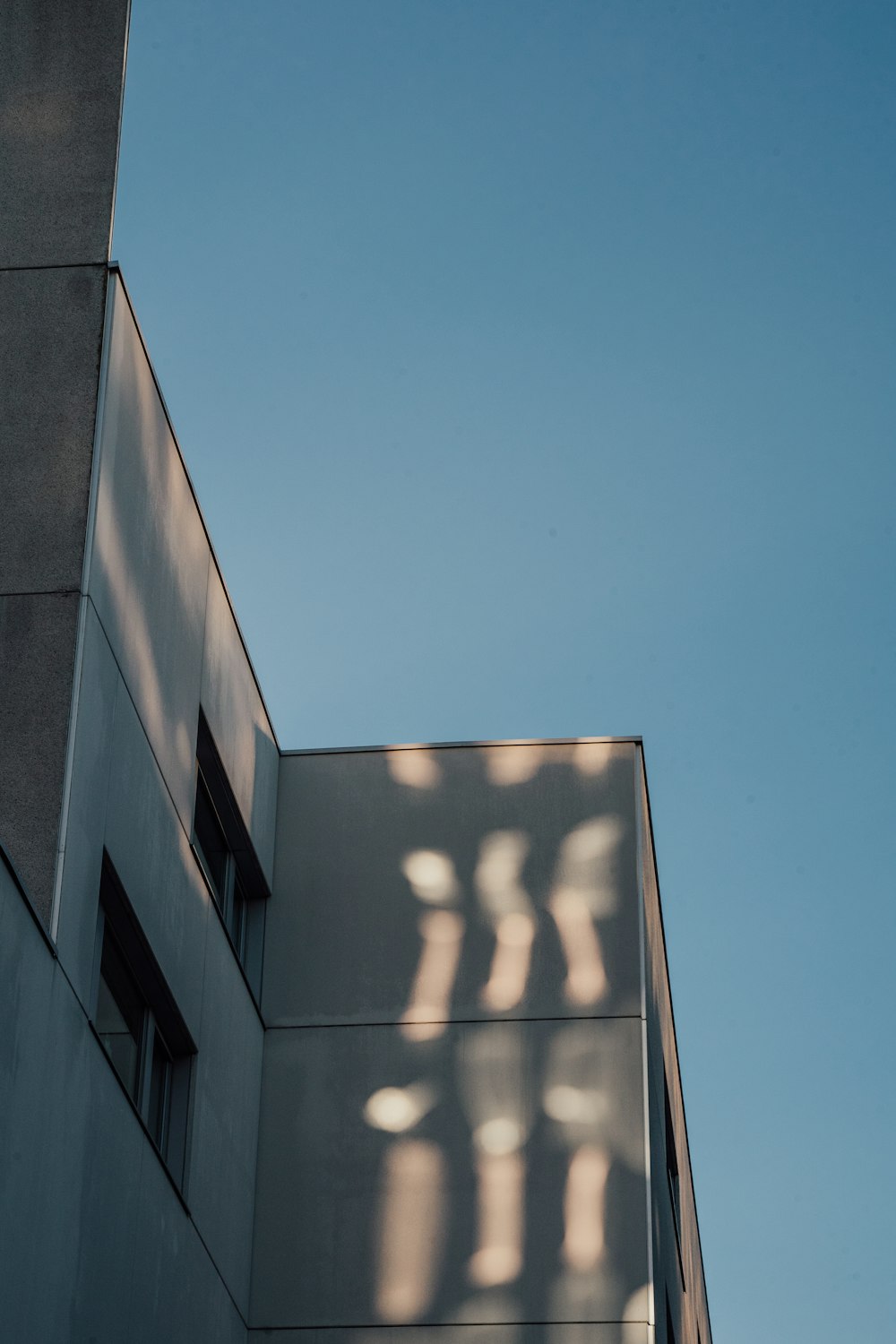 a building with a shadow on the side
