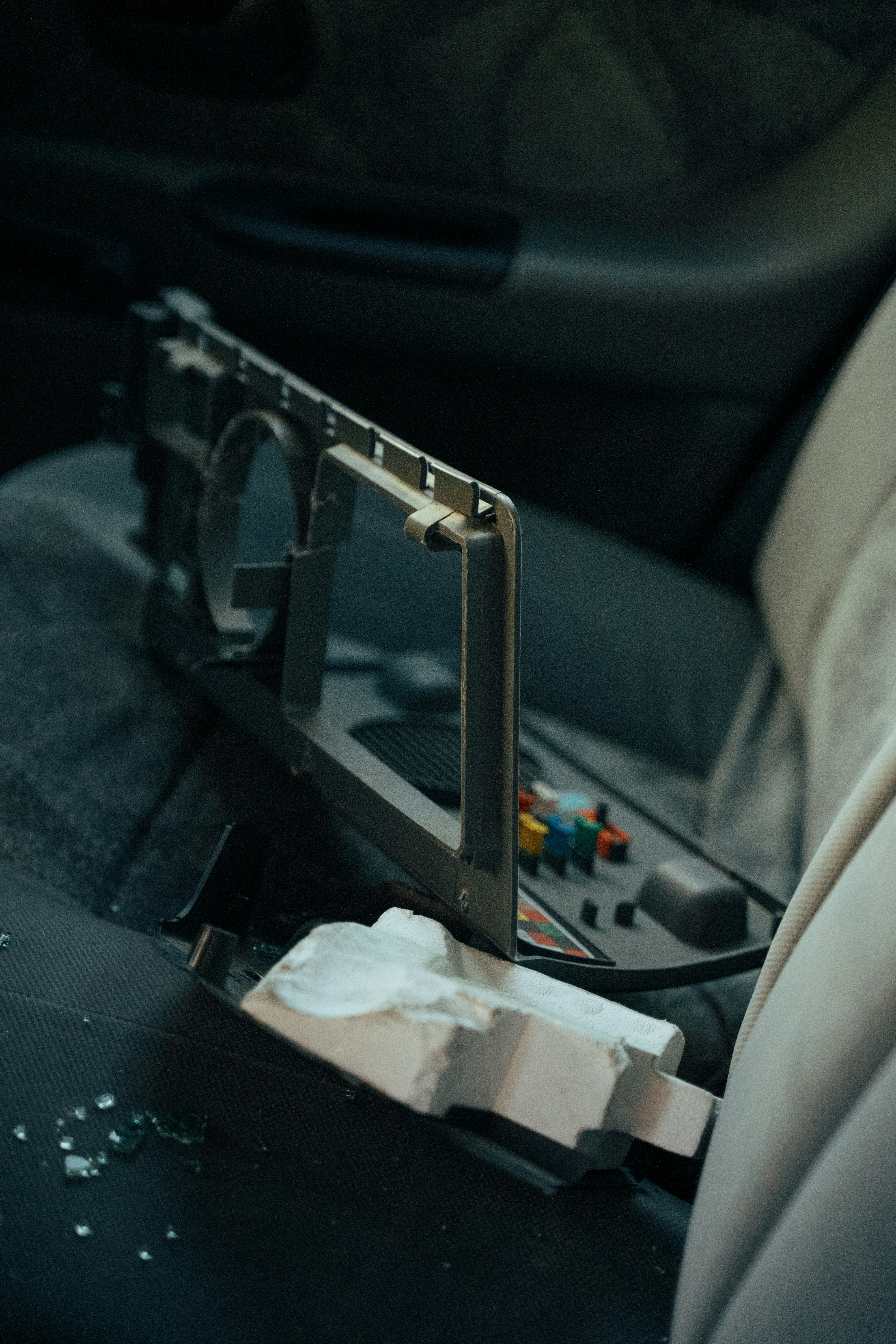 a car seat with a bag of trash in it