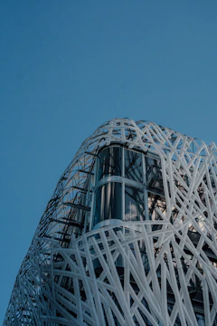 Architectural stainless steel mesh on a modern building facade.