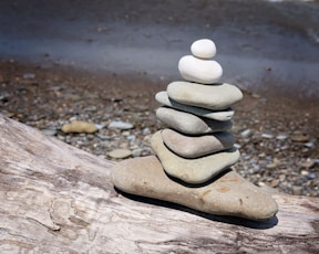 a stack of rocks on a wood surface