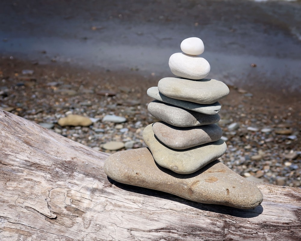 a stack of rocks on a wood surface