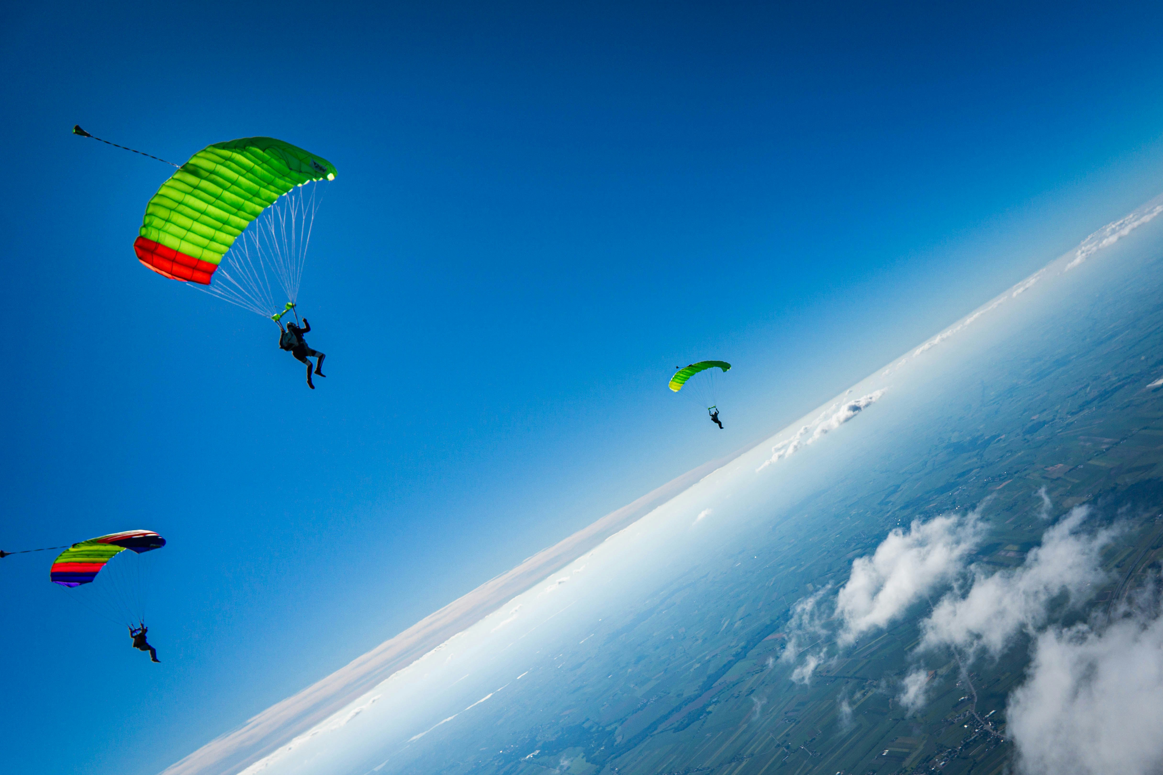 a group of people parachuting