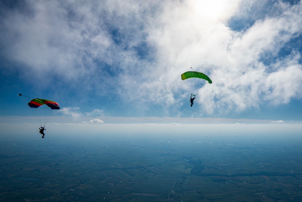 a couple of people parasailing