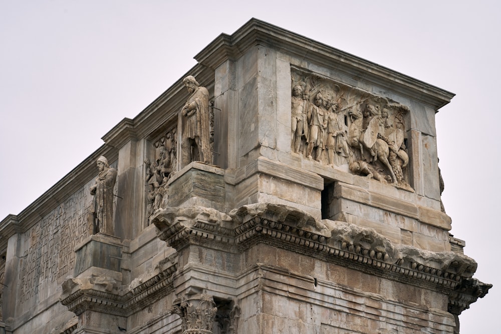 a building with statues on the side