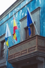 a building with flags on the side