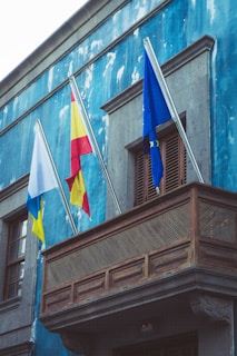 a building with flags on the side