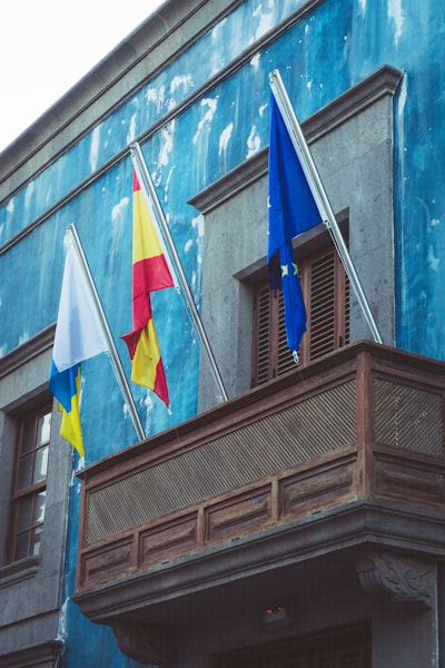 a building with flags on the side