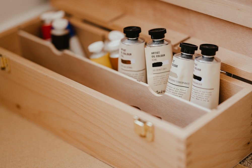 a group of bottles in a wooden box