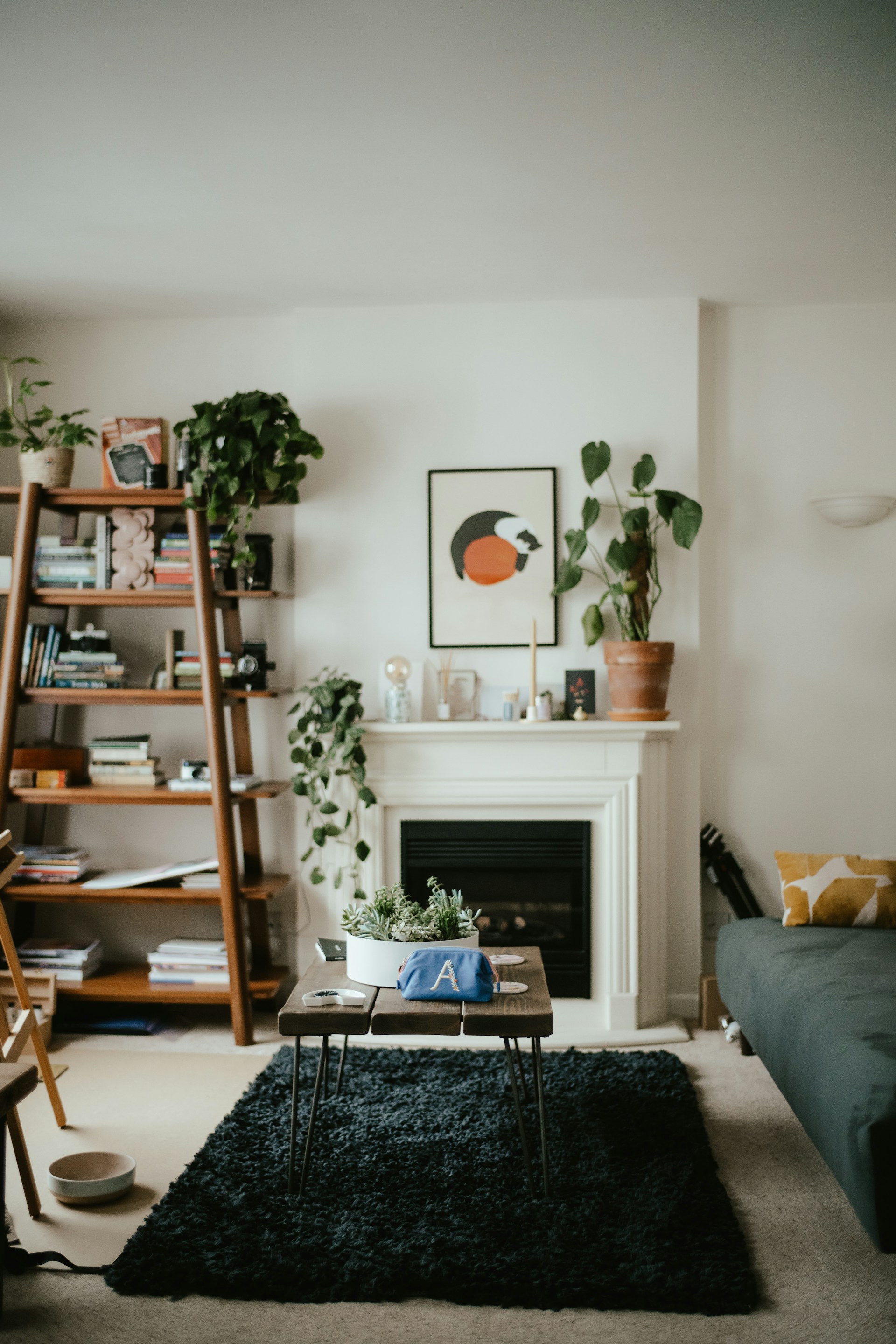 A cozy living room with sleek, tailored wooden shelves and furniture in soft natural tones.