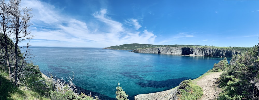 a body of water with land in the back