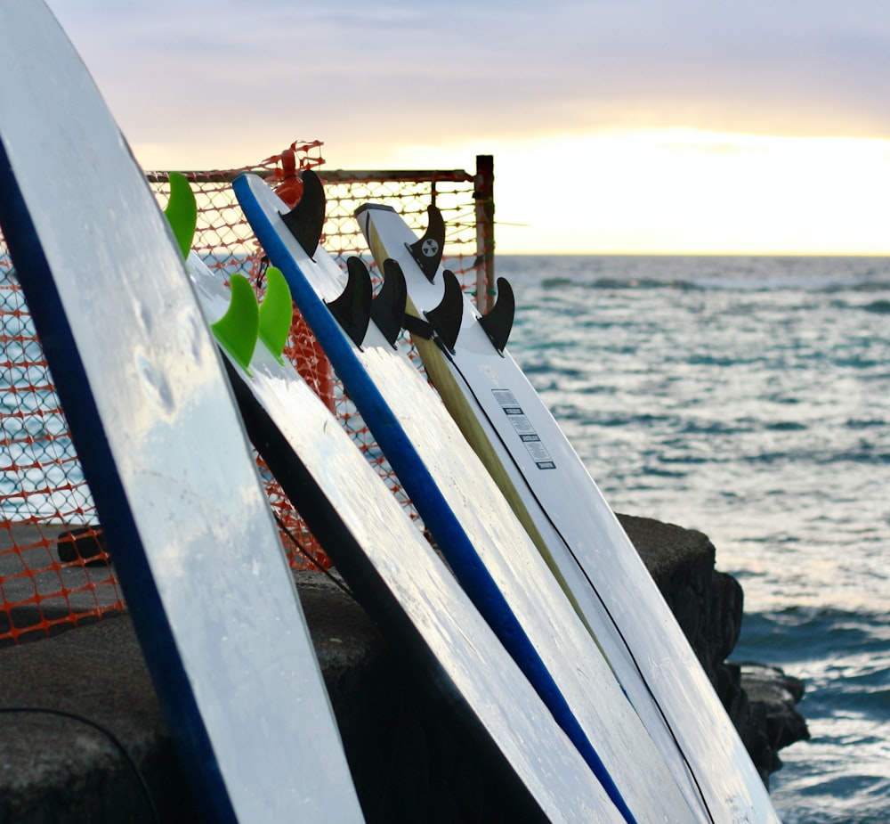 a row of surfboards on a boat