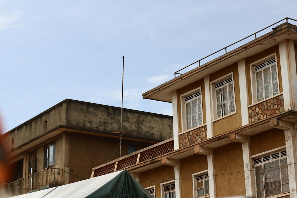 a building with a green tent