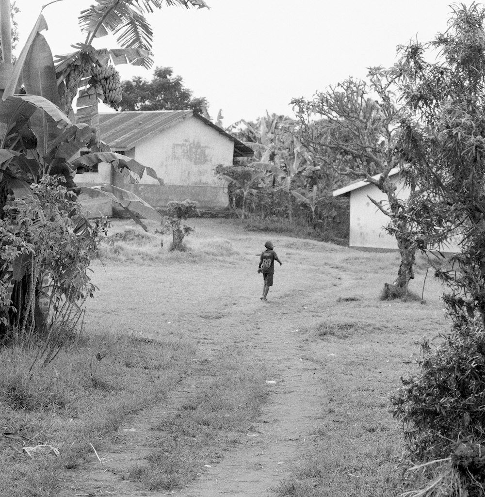 a person walking on a dirt path