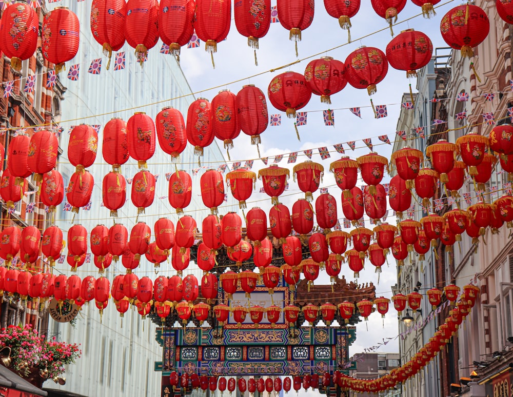 a group of red lanterns from a ceiling