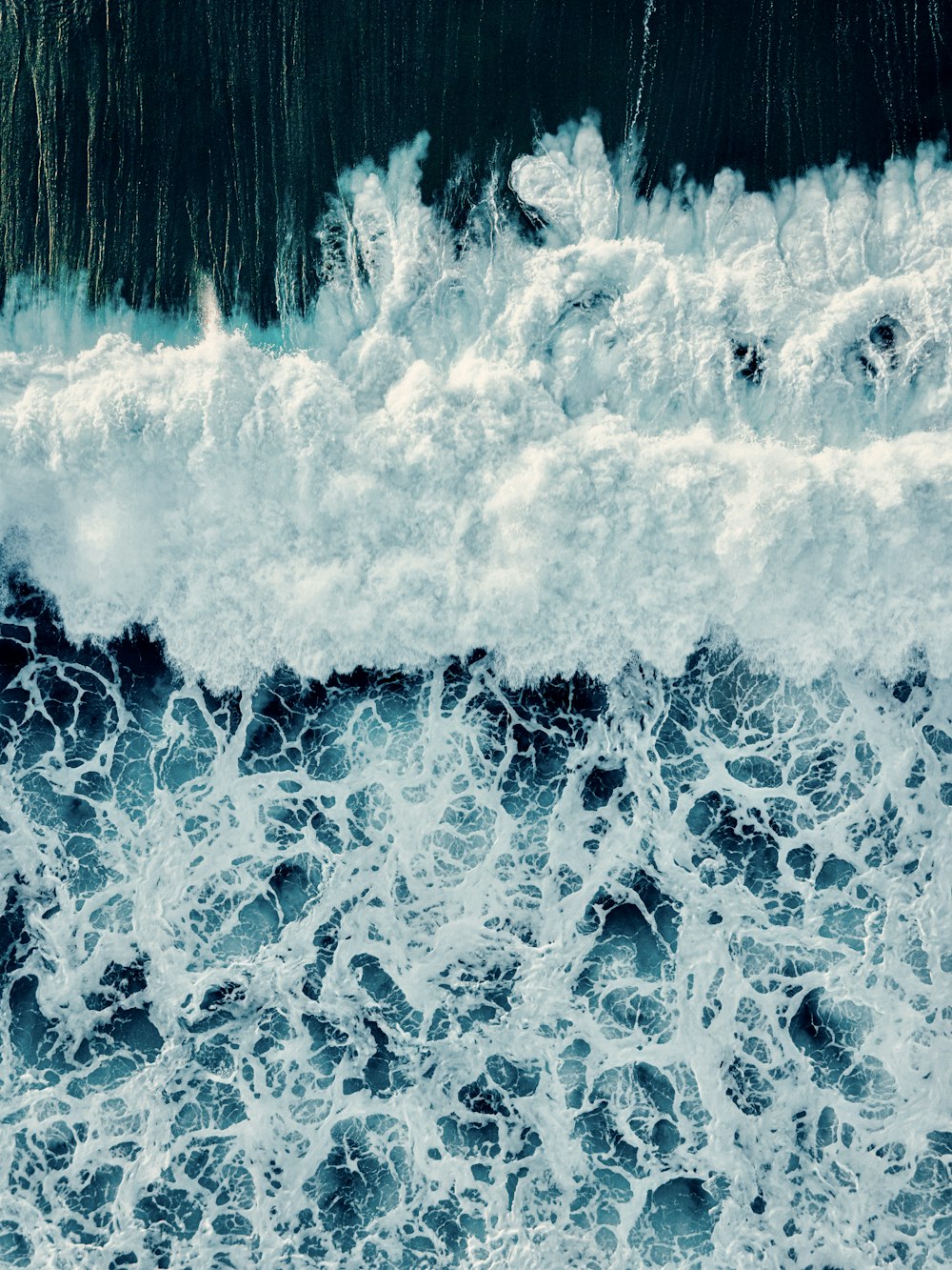 a wave crashing on a beach