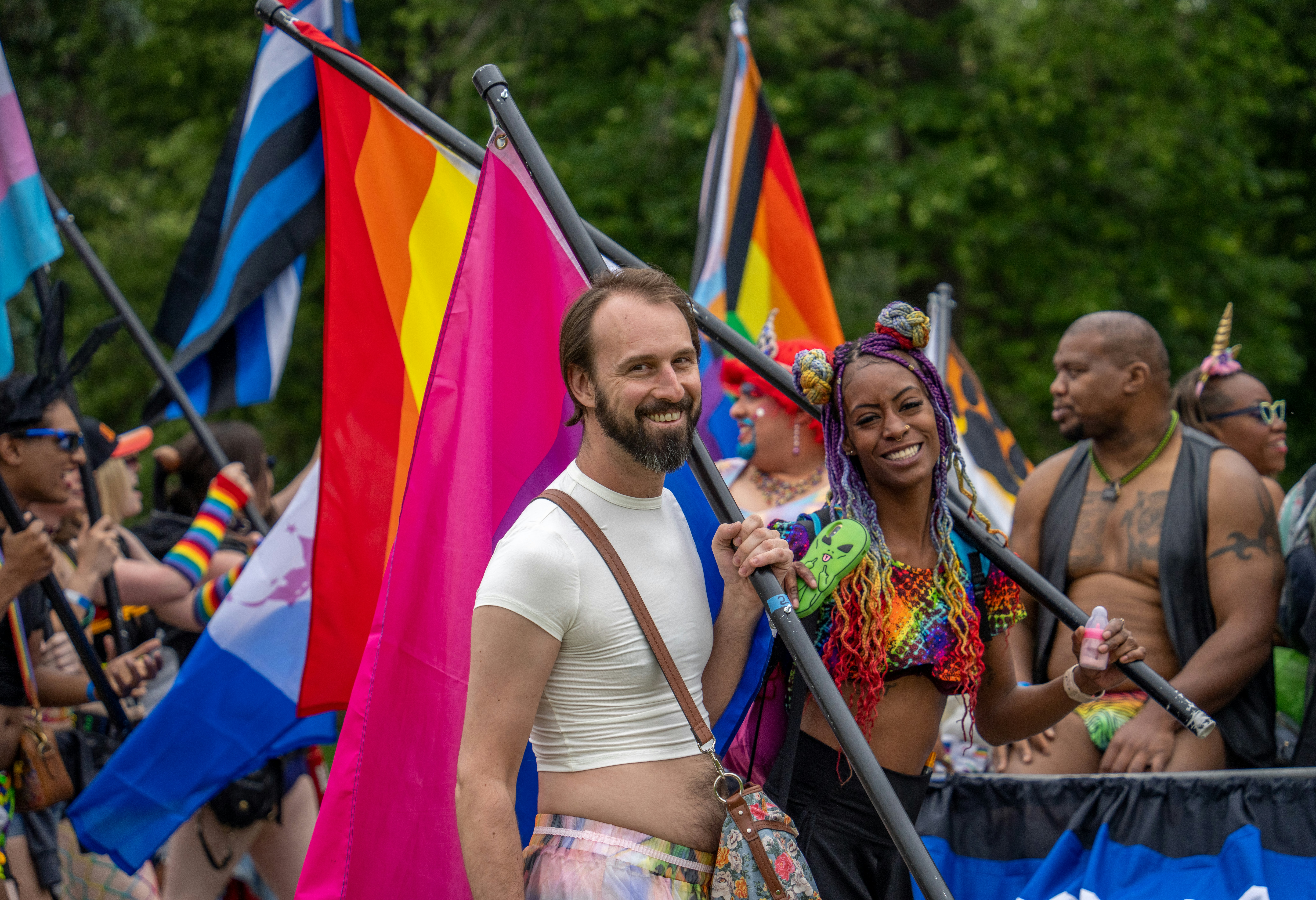 a group of people holding flags