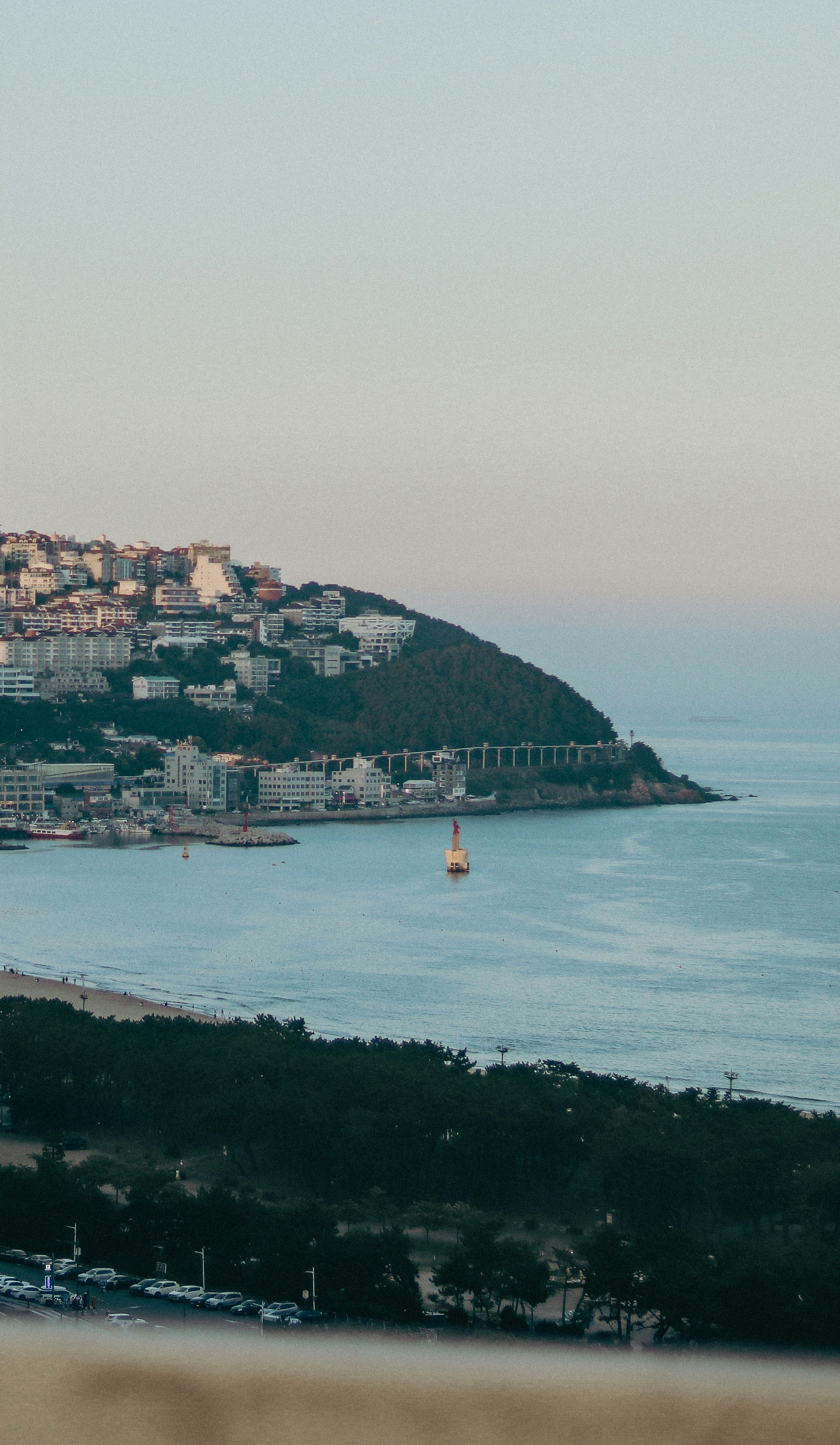 a body of water with a city on the other side of it