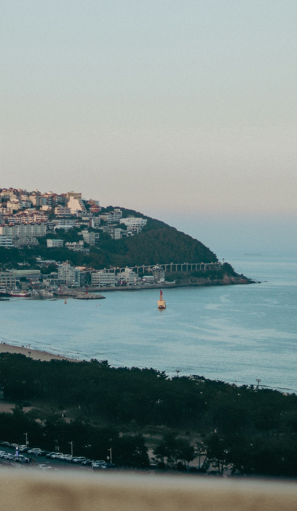 a body of water with a city on the other side of it