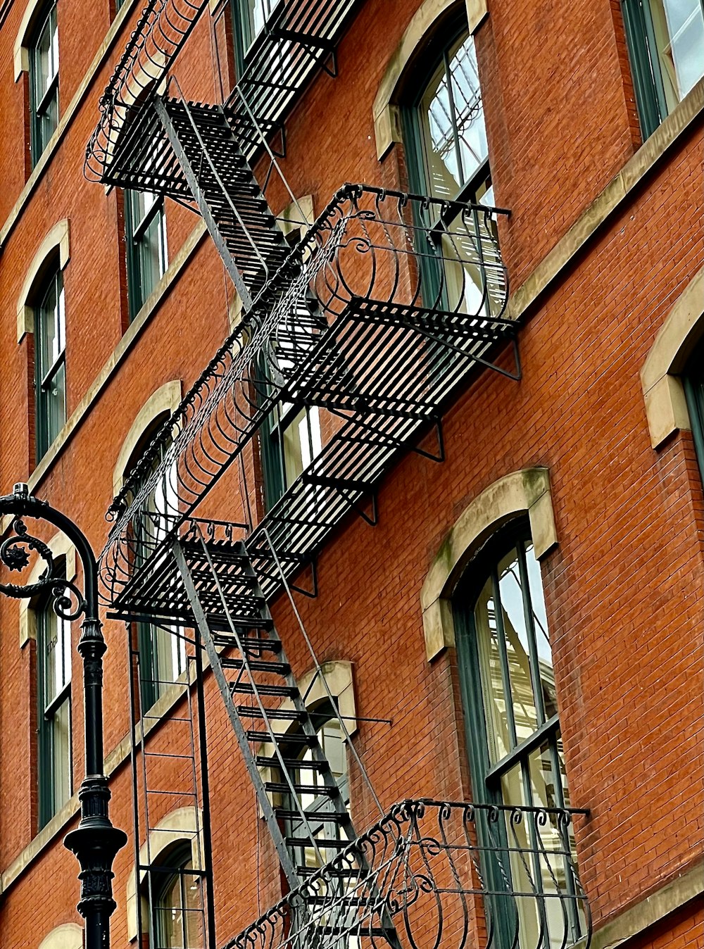 a brick building with a couple of balconies and a couple of balconies