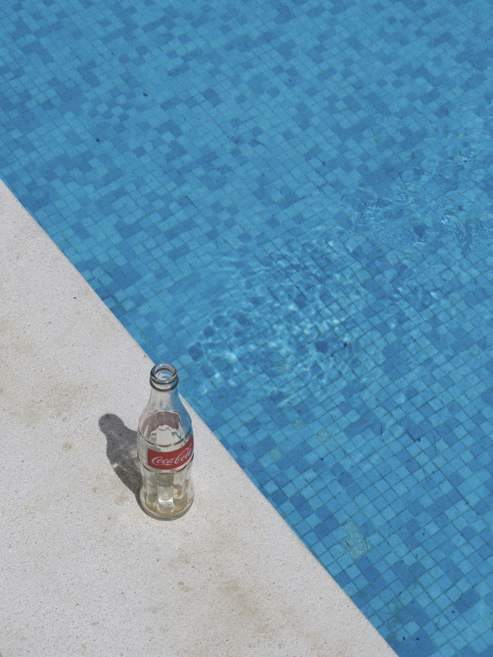 a bottle of water on a blue mat