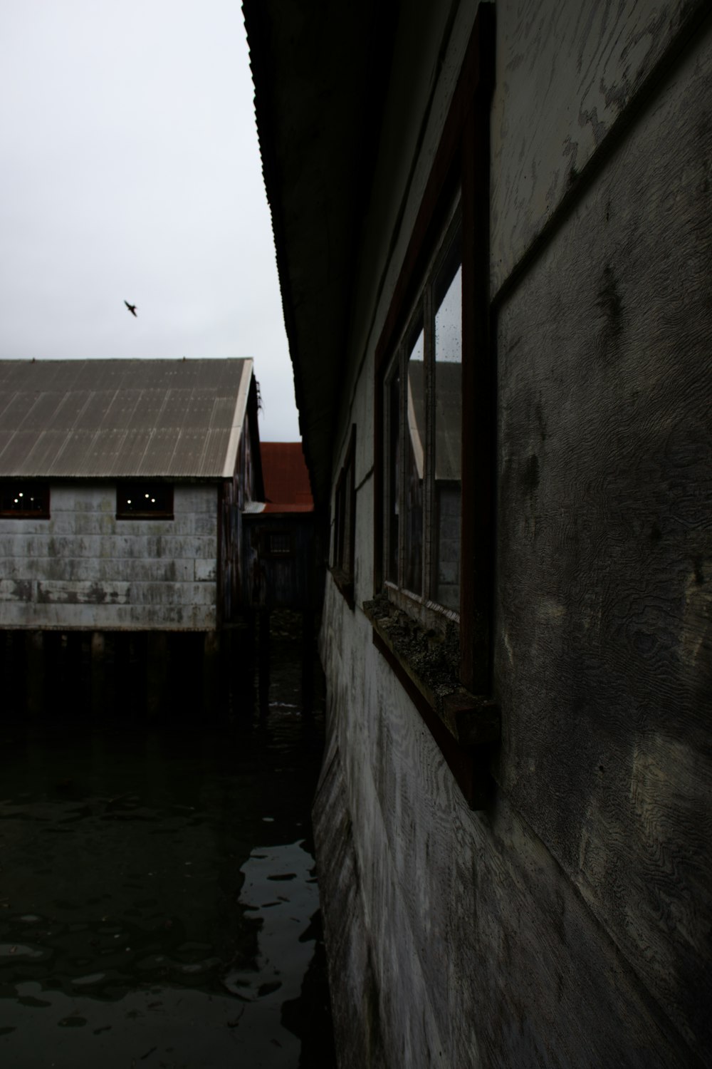 a building next to a body of water