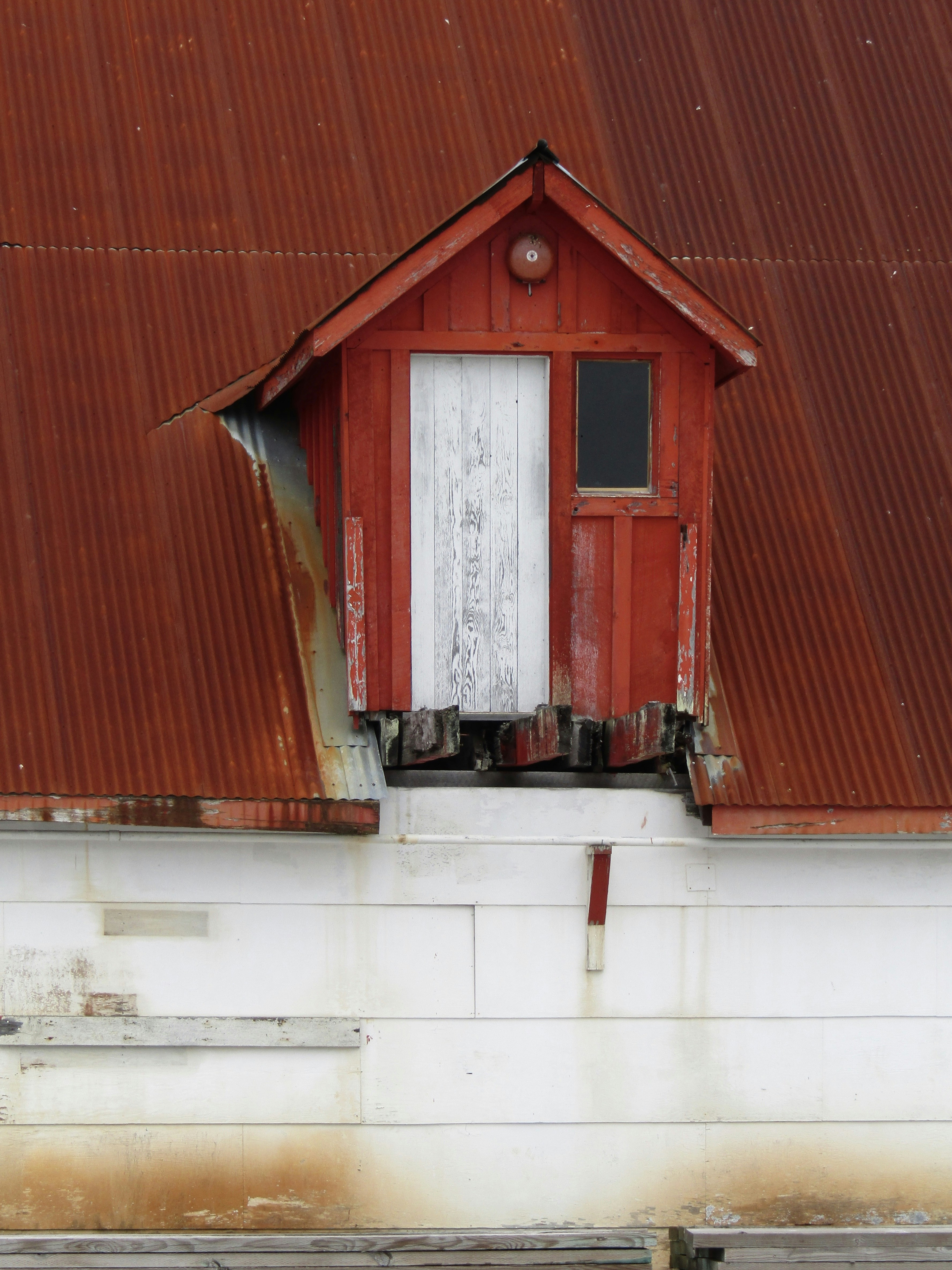 a red building with a white door