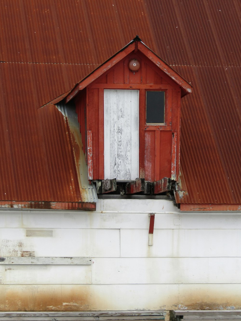 a red building with a white door