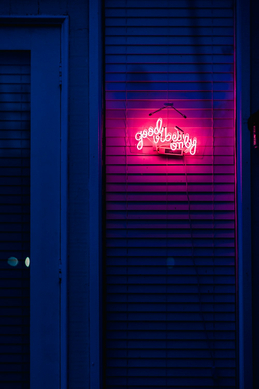 a red sign on a blue building