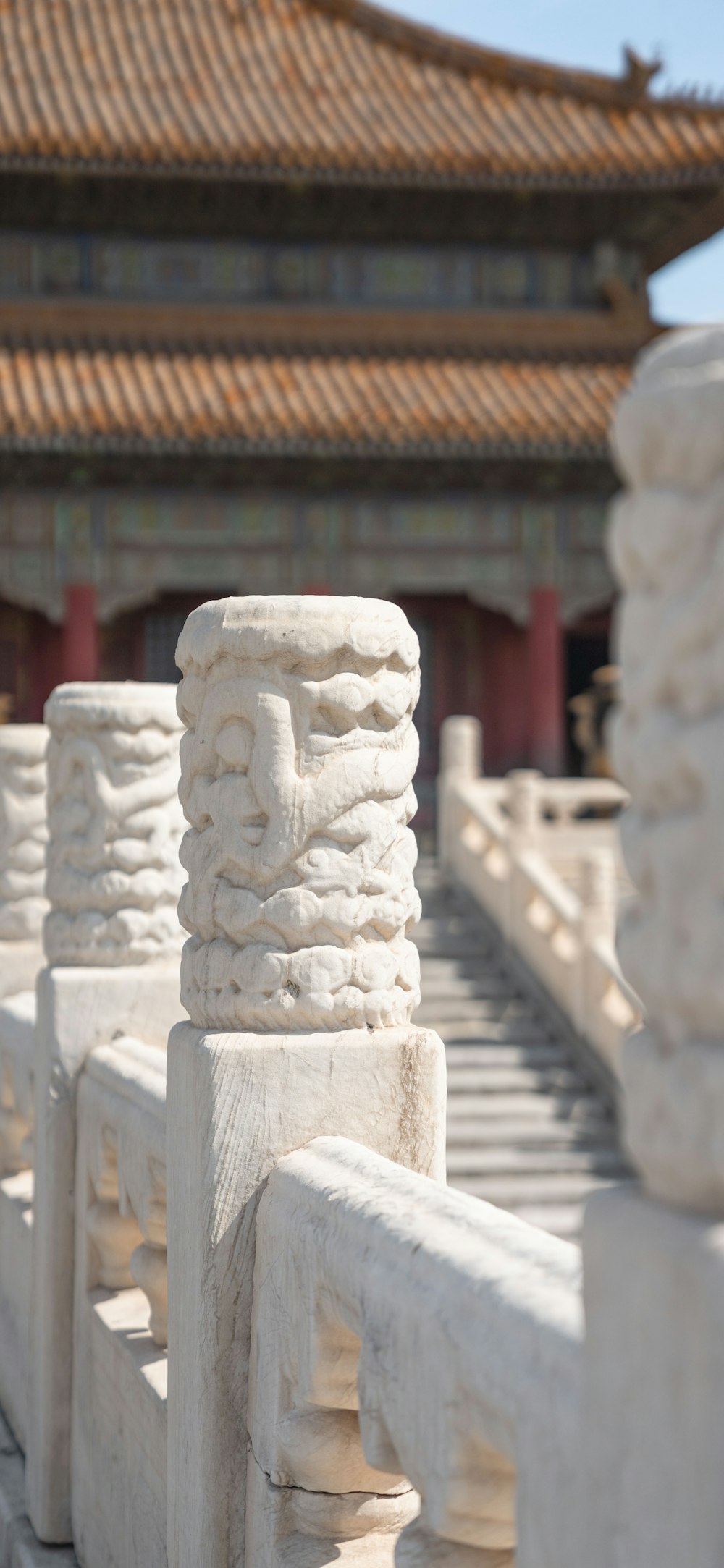 a stone statue in front of a building