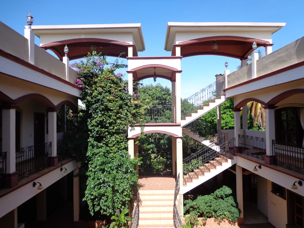 a building with a staircase and trees