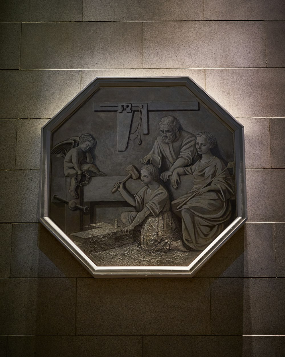 a stone plaque with a group of men on it