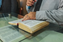 a person writing on a book