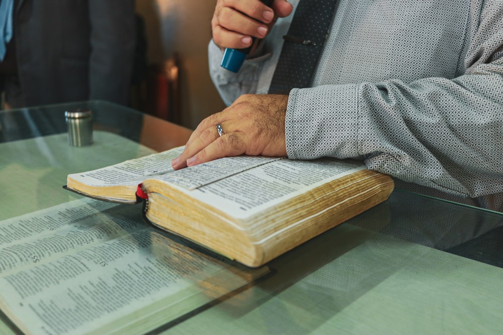 a person writing on a book