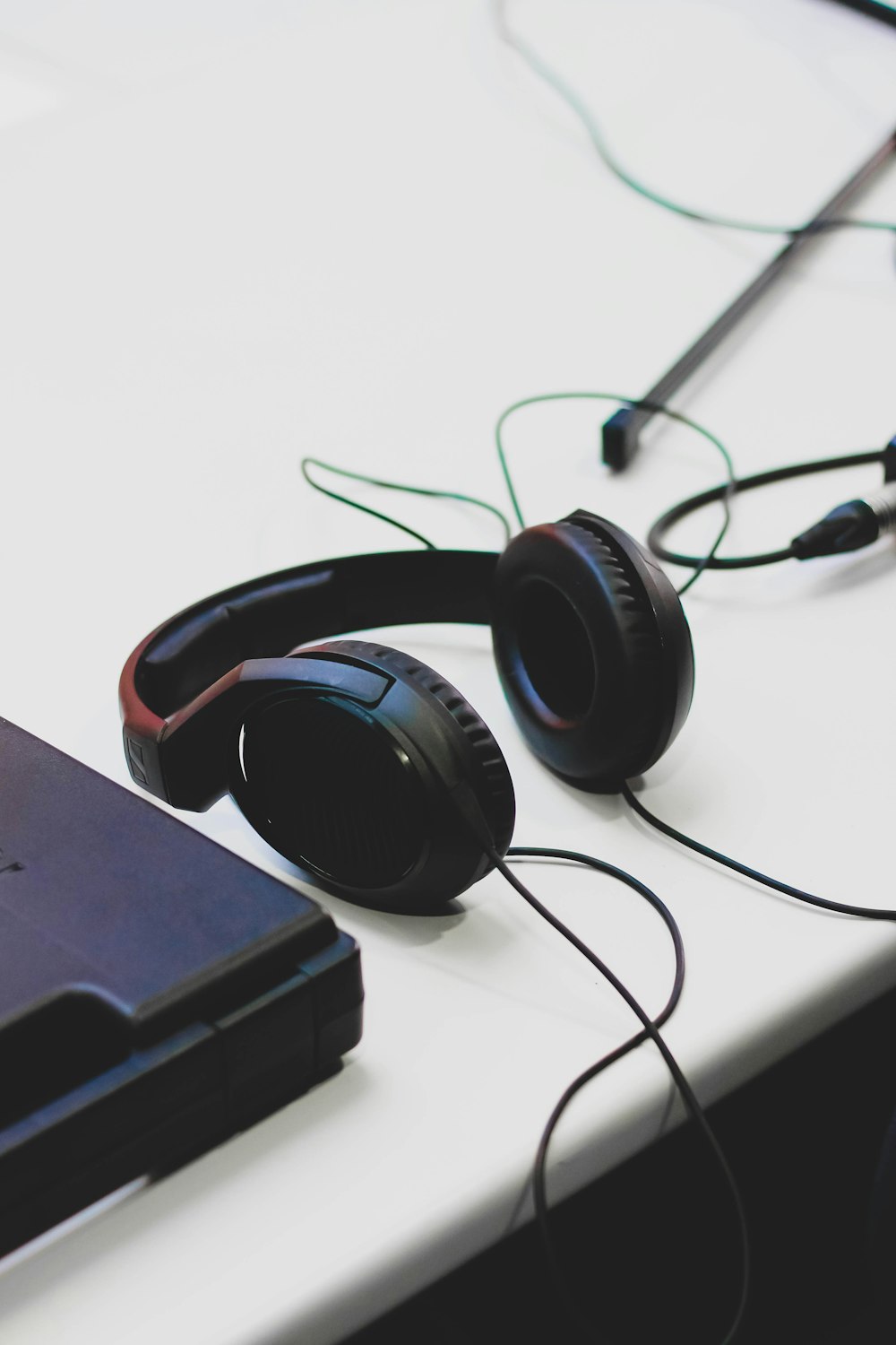 a pair of headphones on a white surface