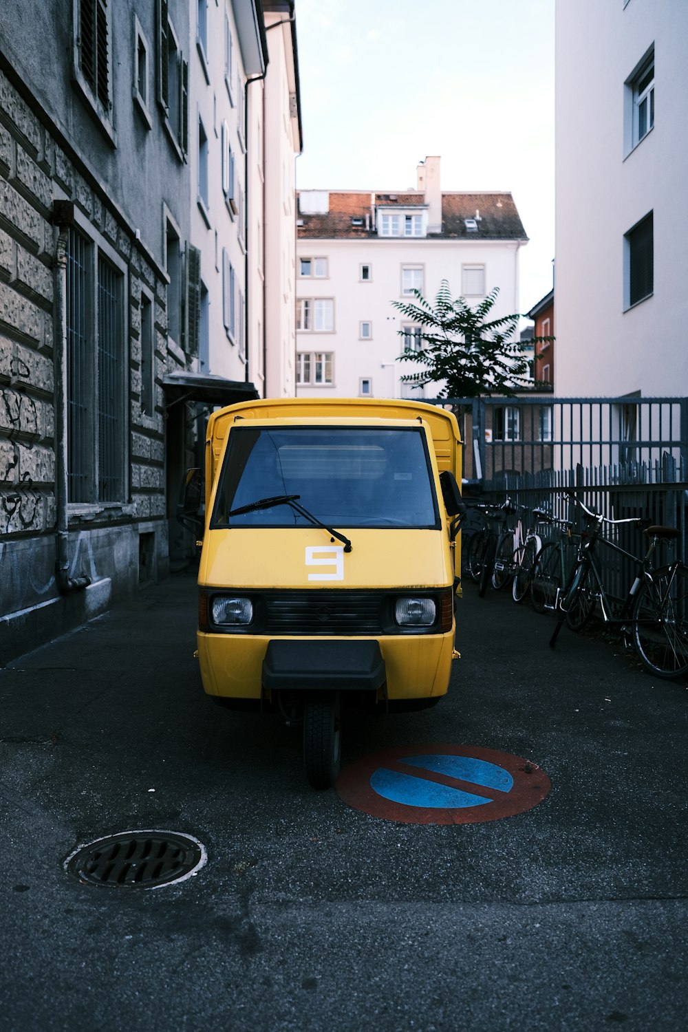 a yellow van parked on a street