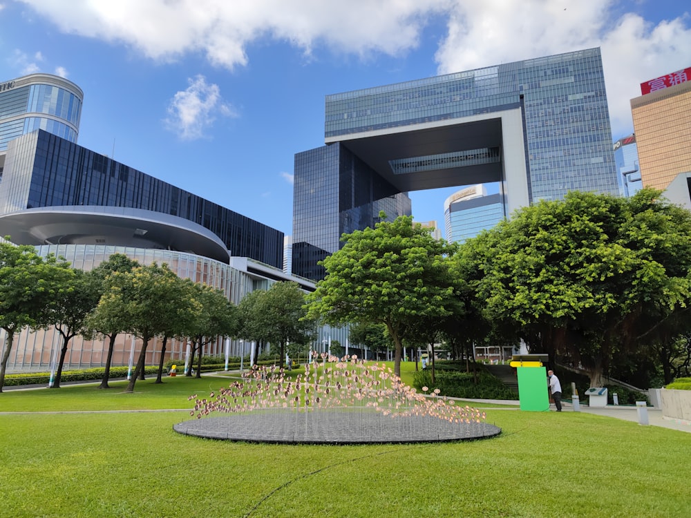 a large building with a circular fountain in front of it