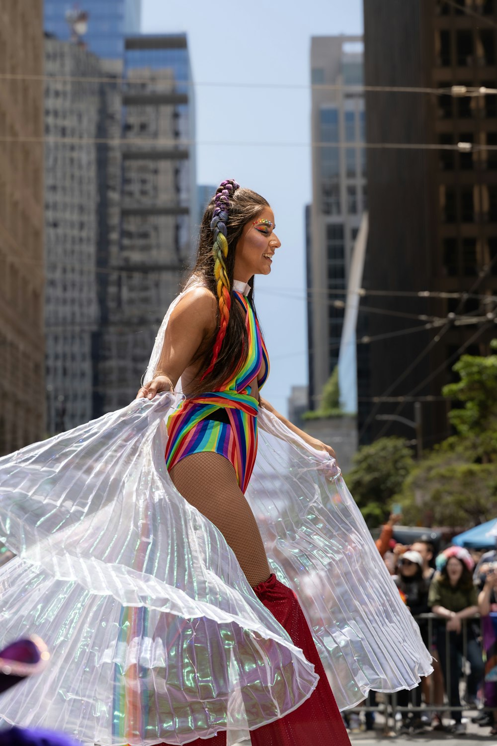 a person in a dress and a colorful dress walking in a city