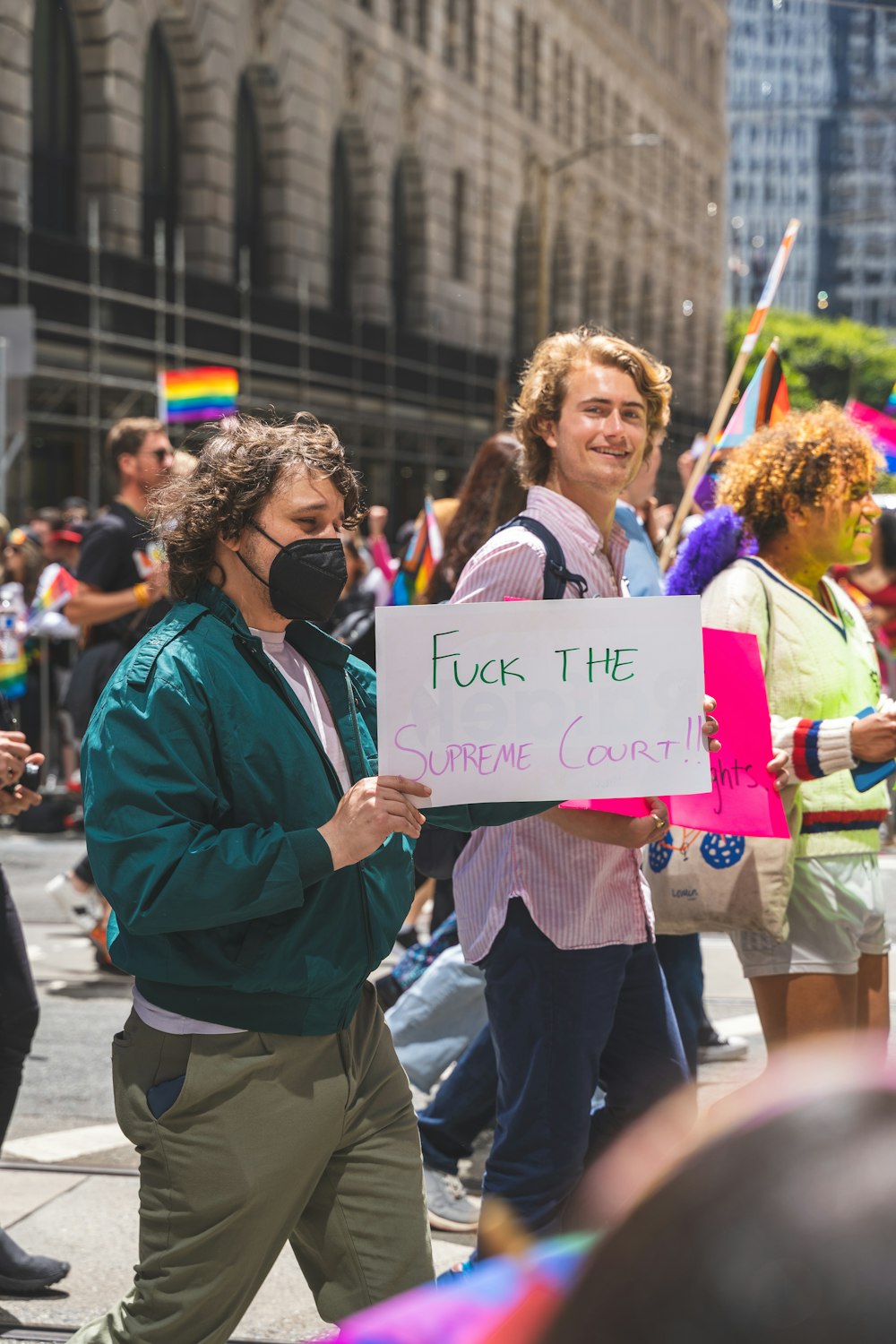 a group of people holding signs