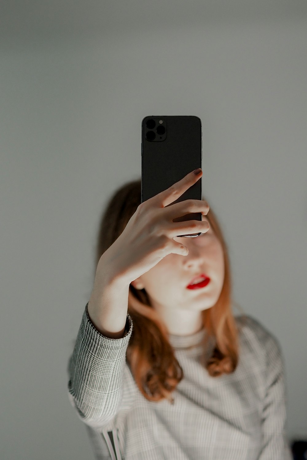 a woman taking a selfie